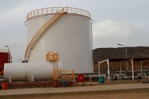 Fuel and oil system specified by Indulec. This site is in North Africa and construction of the tanks was by local contractors to satisfy local employment requirements during the power plant construction. The red tank in the background is a water tank for the power plant’s firefighting system. The large tank is for diesel with the two horizontal tanks for lubrication oil and recovered used engine oil. The fuel offloading bay can service two delivery vehicles simultaneously