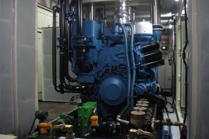 Engine 'services' in front of the engine including diesel filters, diesel cooler, small oil replenishment tank, fuel and oil intake solenoids, flow metering units, pre-lube pump, etc.